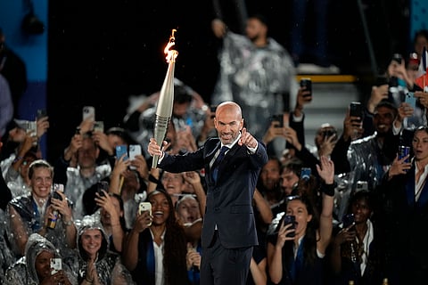 Zinedine Zidane carries the 2024 Olympic torch